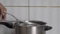 Dal taking out from stainless steel cooker Lokgram Kalyan
