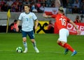 Daler Kuzyaev against Austrian midfielder Peter Zulj