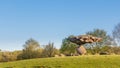 DALFSEN, NETHERLANDS, - May 01, 2015: Floating stone on a hill