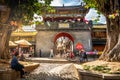 Zhoucheng ancient village view with Bai architecture and people and old gate in Zhoucheng Dali Yunnan China Royalty Free Stock Photo