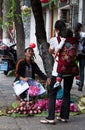 DALI, CHINA, 20 SEPTEMBER 2011: woman selling lotus flowers at t