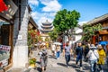 Dali old town main street view called Fuxing road with people and Wuhua tower in background in Dali Yunnan China Royalty Free Stock Photo