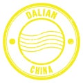 DALIAN - CHINA, words written on yellow postal stamp