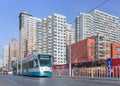 City scape with approaching tram on a sunny day, Dalain, China