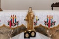 The small statuette depicting the Mother of God with a baby in her arms stands on a table in the Deir Al-Mukhraqa Carmelite