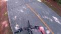 A paved path at the Silver Comet Trail hand on a bike handle bar grip