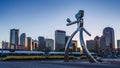 Dallas Sunset Time Lapse: The Travelling Man, steel sculpture, Deep Ellum Station in Dallas.