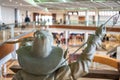 Dallas, Texas, US - 10.2022 - Statue of a cowboy running cattle in the DFW airport rental car facility