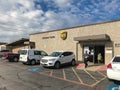 Customer walk in, exit the UPS Customer Centers in Dallas, Texas