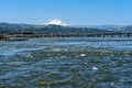 The Dalles Bridge crosses the Columbia River between Oregon and Washington with Mount Hood rising behind it Royalty Free Stock Photo