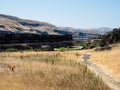 Freight train running along Columbia River Gorge in eastern Washington State