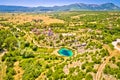 Dalmatia hinterland. Cetina river source and Orthodox church aerial view Royalty Free Stock Photo