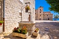 Dalmatian stone architecture and ancient well in Kastel Stafilic