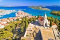 Dalmatian town of Tribunj church on hill and amazing turquoise archipelago aerial view Royalty Free Stock Photo