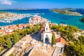 Dalmatian town of Tribunj church on hill and amazing turquoise archipelago aerial view