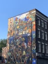 The Dalston Lane Mural, painted in 1985 by Ray Walker. This now iconic image is based on the 1983 Hackney Peace Carnival