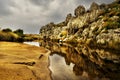 Dalyan river delta. dramatic weather. Turkey. Rocks reflecting in the river. Royalty Free Stock Photo