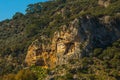 DALYAN, TURKEY: Rock-cut temple tombs of the ancient city Kaunos in Dalyan. Royalty Free Stock Photo