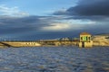 Dam Flood control building at full reservoir at Sunset. Lake Lahontan.