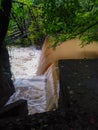 Old Historic Hydroelectric Dam and Horse and Buggy Bridge over flooded creek. Royalty Free Stock Photo