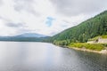 The dam and lake Oasa, river Sebes, pine forests Royalty Free Stock Photo