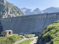 The dam Lucendro or concrete dam on the reservoir lake Lago di Lucendro in the Swiss alpine area of the St. Gotthard Pass