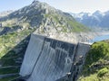 The dam Lucendro or concrete dam on the reservoir lake Lago di Lucendro in the Swiss alpine area of the St. Gotthard Pass