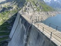 The dam Lucendro or concrete dam on the reservoir lake Lago di Lucendro in the Swiss alpine area of the St. Gotthard Pass