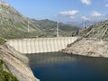 The dam Lucendro or concrete dam on the reservoir lake Lago di Lucendro in the Swiss alpine area of the St. Gotthard Pass