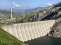 The dam Lucendro or concrete dam on the reservoir lake Lago di Lucendro in the Swiss alpine area of the St. Gotthard Pass