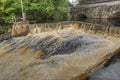 Dam and old stone bridge of the hydroelectric power station in HDR Royalty Free Stock Photo