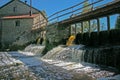 Dam at the old water mill made of stones. Royalty Free Stock Photo