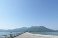 Dam pond, mountains and blue sky