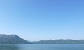 Dam pond, mountains and blue sky