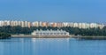 Dam and reservoir. Power, environment. The Serangoon Reservoir East Dam over Sungei Serangoon with Punggol Town on the background