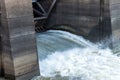 Dam spillway gate with water flowing through