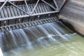 Dam spillway gate with water flowing through