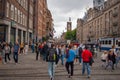 Dam Square with pedestrians in center of Amsterdam at summer season Royalty Free Stock Photo