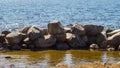 Dam from stones. dyke made from natural materials. pile of rocks in water