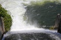 Dam wall and overflow of Iskar Dam. Water flowing over a dam wall. Mist rising above the Iskar dam wall. Cascade from a hydroelect Royalty Free Stock Photo