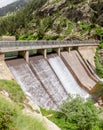 Dam Wall with waterfall in Nuria Valley Royalty Free Stock Photo