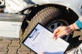 Damaged car and damage assessment with a list