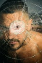 Damage. sexy hispanic man broken mirror. anger. destruction. crush test. theft. emotional discharge. bullet hole in