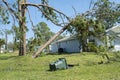 Damage to Florida house roof from uprooted tree after hurricane. Insurance claim on destroyed home. Aftermath of natural Royalty Free Stock Photo