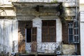 Damaged balcony and wooden shutters in an abandoned building in Achrafieh, architecture of old heritage buildings in Beirut, Leban Royalty Free Stock Photo