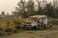 A damaged broken useless SUV car standing road side as a scrap