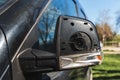 Damaged broken wing mirror of an passenger car on parking lot