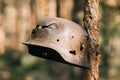 Damaged By Bullets And Shrapnel Metal Helmet Of German Infantry