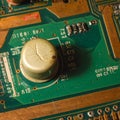 Damaged Capacitor on a Computer Circuit Board Royalty Free Stock Photo