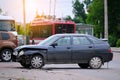 Damaged in car accident vehicle on city street crash site